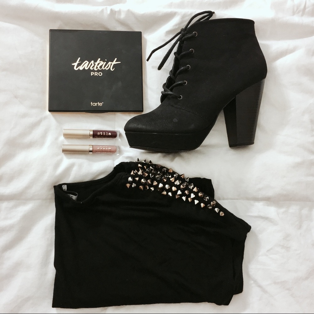 Black short sleeve top with gold spiked shoulders